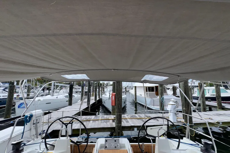 Bluebird Yacht Photos Pics 2022 Beneteau Oceanis 40.1 yacht docked at marina, view from cockpit under canopy.