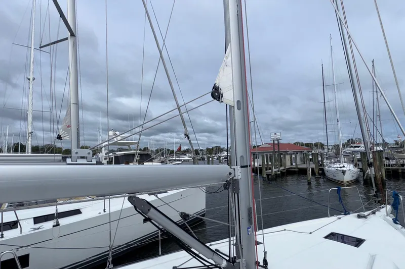 Bluebird Yacht Photos Pics 2022 Beneteau Oceanis 40.1 sailboat docked at a marina under cloudy skies.