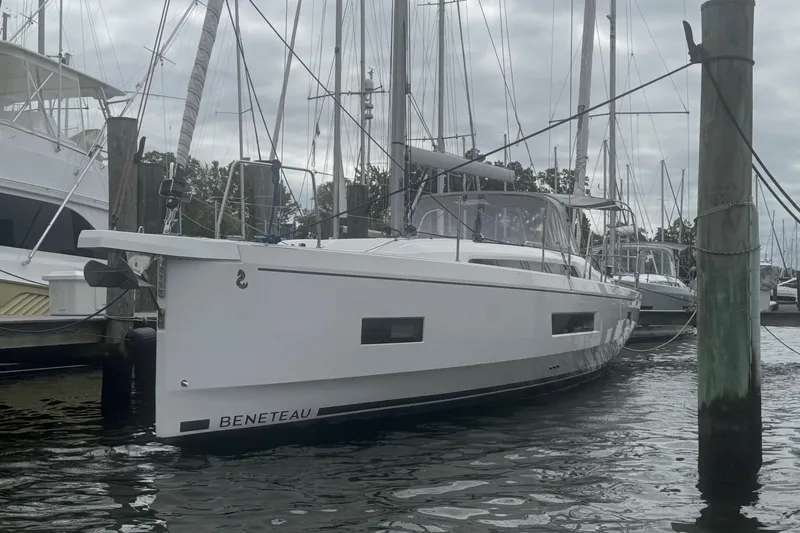 Bluebird Yacht Photos Pics 2022 Beneteau Oceanis 40.1 yacht docked at marina, overcast sky.