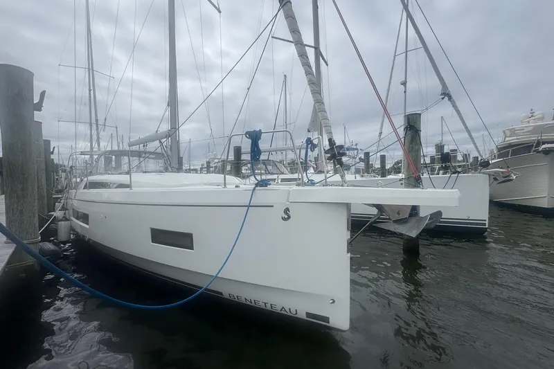 Bluebird Yacht Photos Pics 2022 Beneteau Oceanis 40.1 sailboat docked at marina, overcast sky.