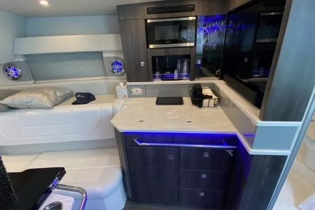  Yacht Photos Pics Interior of 2020 Formula 430 Super Sport Crossover with modern kitchen and seating area.