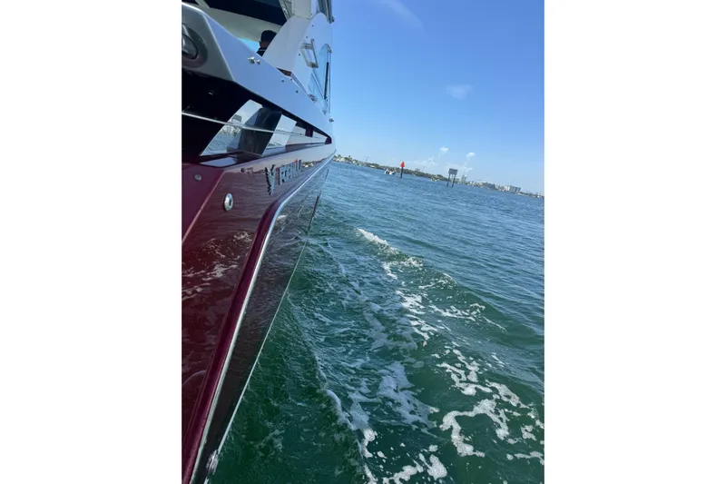  Yacht Photos Pics 2020 Formula 430 Super Sport Crossover cruising on open water under clear blue skies.