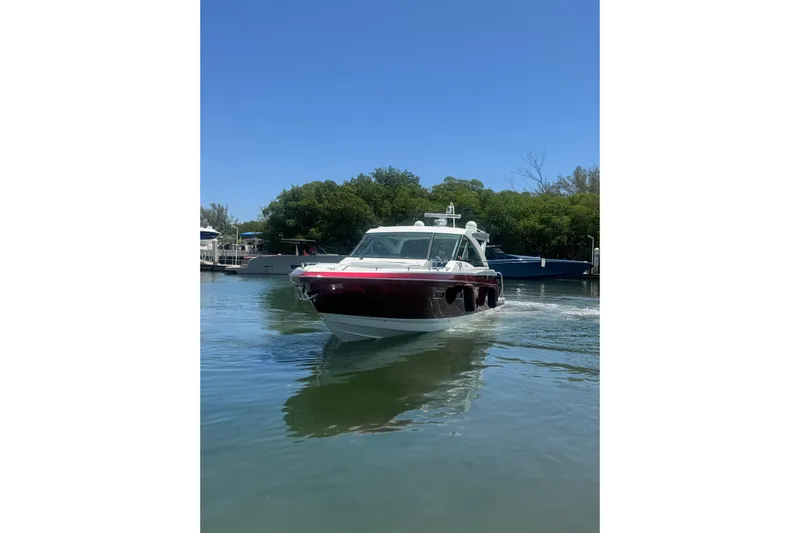  Yacht Photos Pics 2020 Formula 430 Super Sport Crossover boat cruising on a calm waterway.