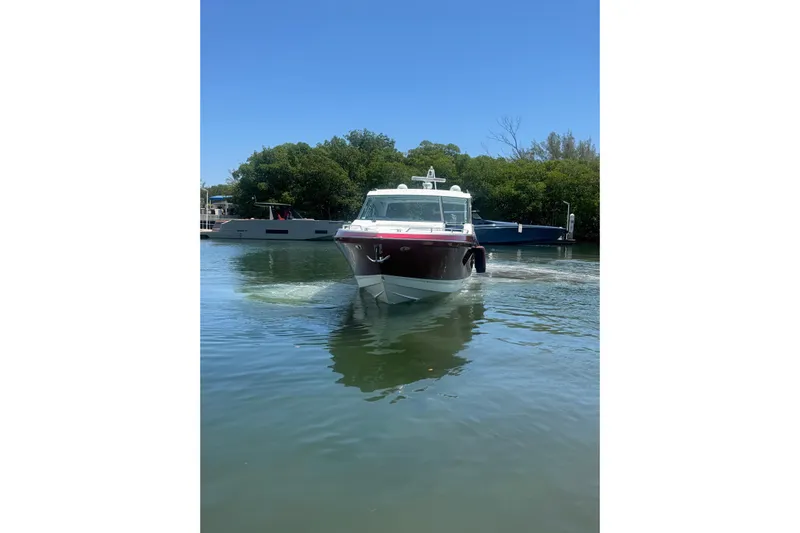  Yacht Photos Pics 2020 Formula 430 Super Sport Crossover boat cruising on a calm waterway.