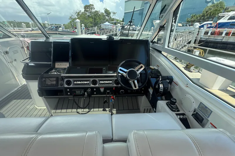  Yacht Photos Pics 2020 Formula 430 Super Sport Crossover helm with modern controls and navigation systems.