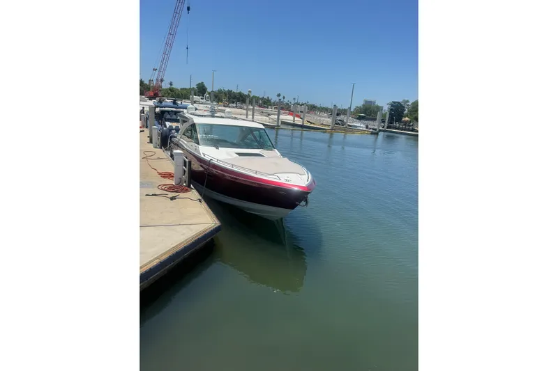  Yacht Photos Pics 2020 Formula 430 Super Sport Crossover docked at marina under clear blue sky.
