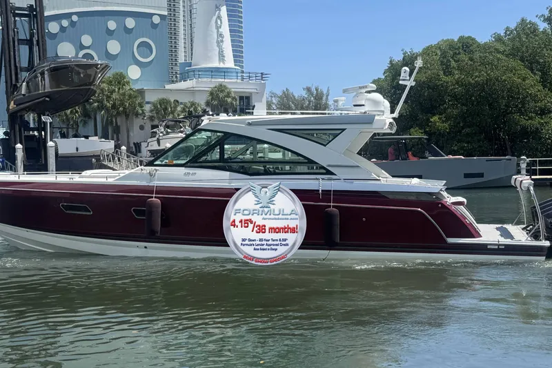  Yacht Photos Pics 2020 Formula 430 Super Sport Crossover yacht docked near modern buildings.