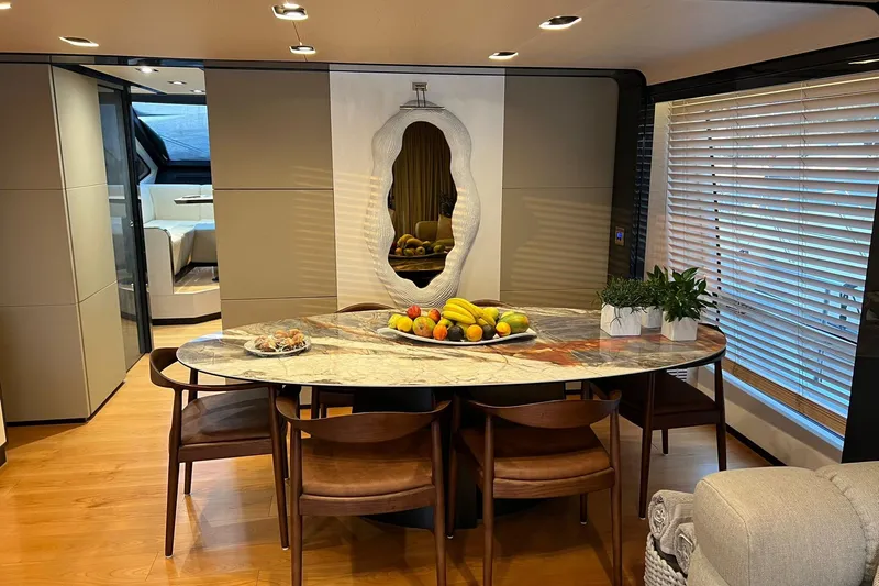  Yacht Photos Pics Luxurious dining area on 2015 Azimut 80 yacht with elegant decor and fruit centerpiece.