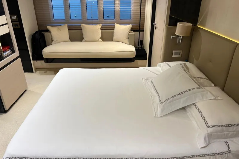  Yacht Photos Pics Luxurious bedroom interior of 2015 Azimut 80 yacht with elegant bedding and seating.