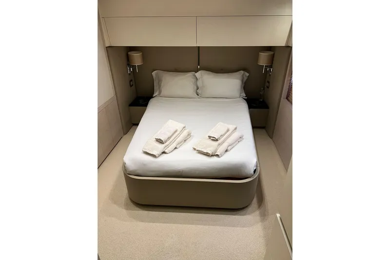  Yacht Photos Pics Luxurious bedroom interior on a 2015 Azimut 80 yacht, featuring a neatly made bed.