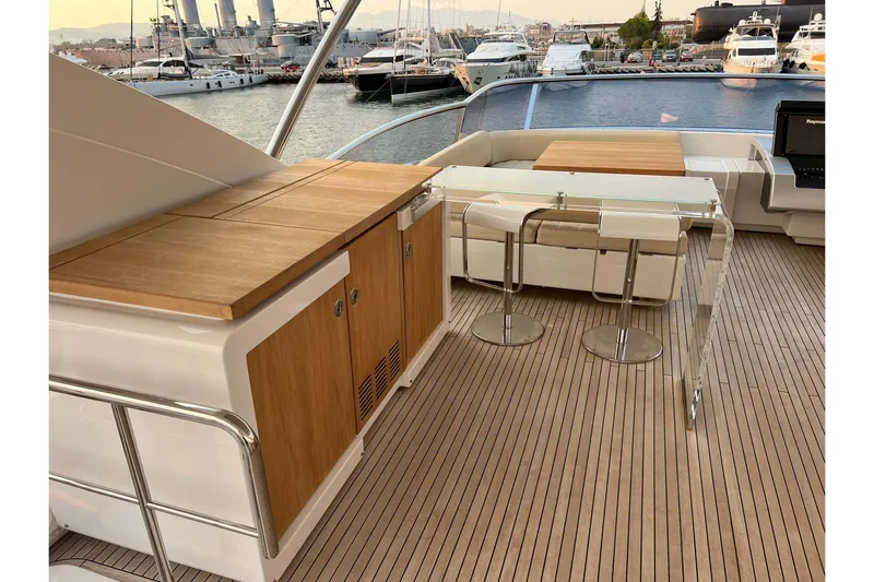  Yacht Photos Pics Luxurious 2015 Azimut 80 yacht deck with elegant seating and wooden cabinetry.