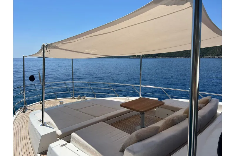  Yacht Photos Pics Luxurious 2015 Azimut 80 yacht deck with sunshade, overlooking serene ocean view.