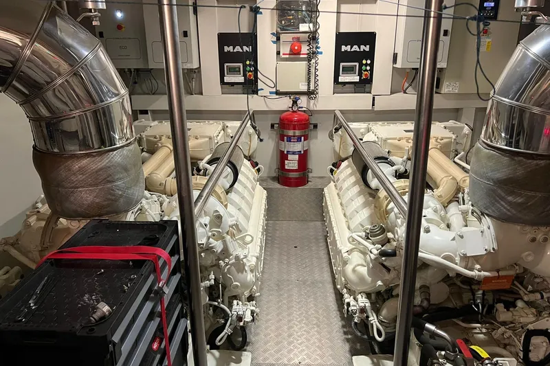  Yacht Photos Pics Engine room of a 2015 Azimut 80 yacht with MAN engines and fire extinguisher.