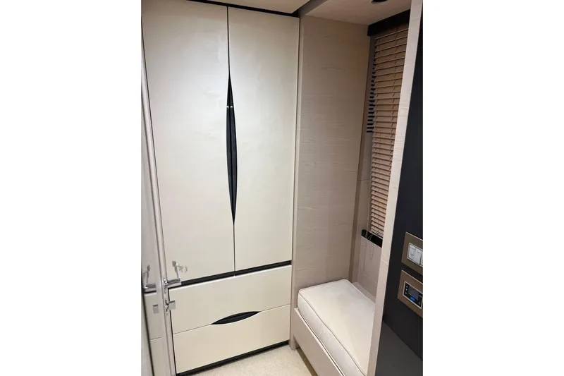  Yacht Photos Pics Luxurious interior of 2015 Azimut 80 yacht featuring sleek cabinetry and seating.