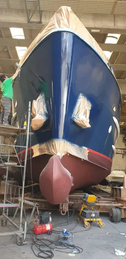  Yacht Photos Pics 2005 Cantieri Nord Est Navalmeccanica Navetta yacht under maintenance in a shipyard.