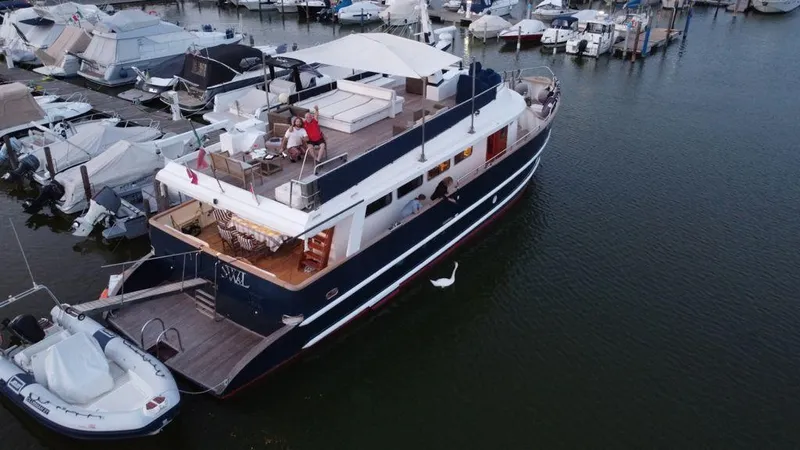  Yacht Photos Pics Luxurious 2005 Cantieri Nord Est yacht docked at marina, featuring spacious decks and elegant design.
