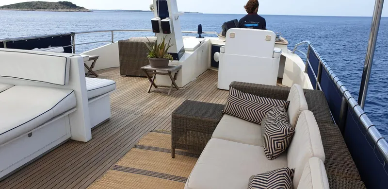  Yacht Photos Pics Luxurious 2005 Cantieri Nord Est yacht deck with seating, ocean view, and modern design.