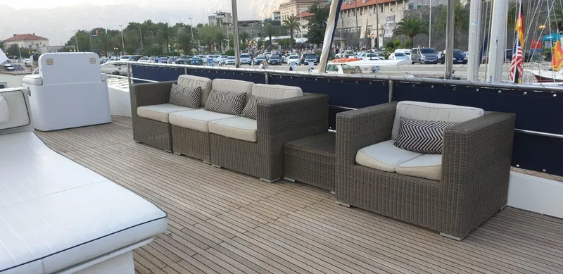 Yacht Photos Pics Outdoor seating on 2005 Cantieri Nord Est Navalmeccanica Navetta yacht deck, with wicker furniture.