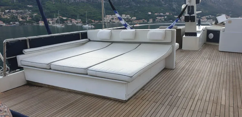  Yacht Photos Pics Luxurious deck of 2005 Cantieri Nord Est Navalmeccanica Navetta yacht with cushioned seating.