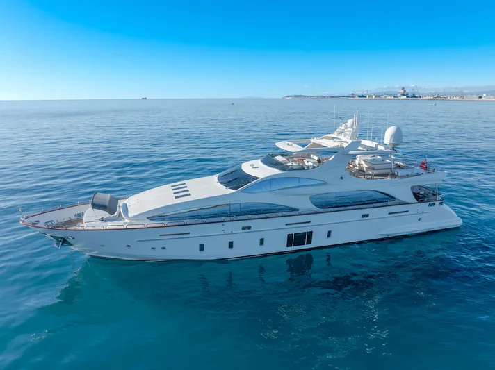  Yacht Photos Pics Luxurious 2013 Azimut 105 yacht cruising on calm blue waters under a clear sky.