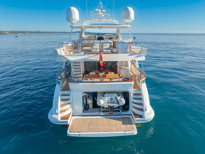  Yacht Photos Pics Luxurious 2013 Azimut 105 yacht on serene ocean waters, showcasing elegant design and spacious deck.