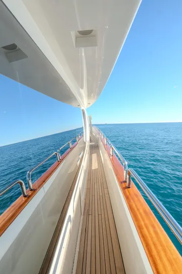  Yacht Photos Pics Side view of 2013 Azimut 105 yacht on open sea under clear blue sky.