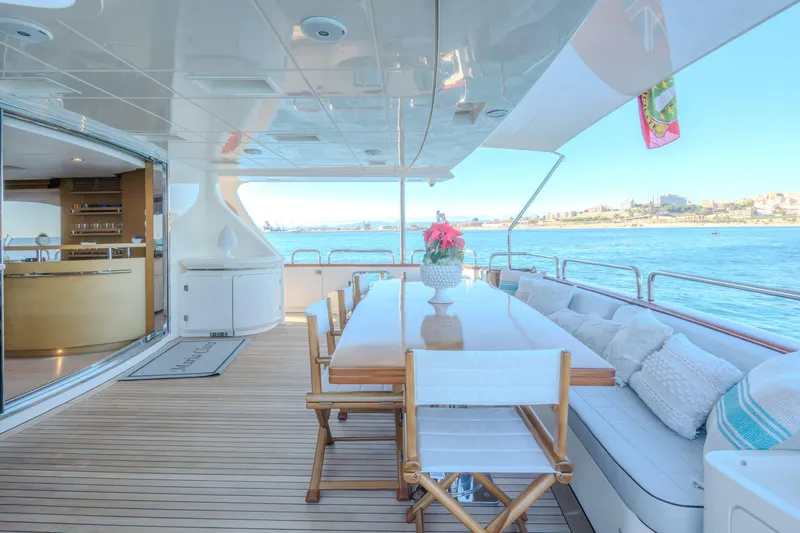  Yacht Photos Pics Luxurious 2013 Azimut 105 yacht deck with dining area overlooking the ocean.