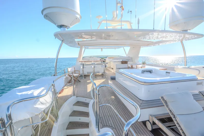  Yacht Photos Pics Luxurious 2013 Azimut 105 yacht deck with sunlit ocean view.