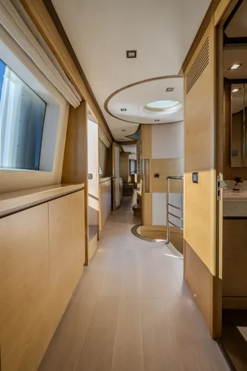  Yacht Photos Pics Luxurious interior hallway of a 2013 Azimut 105 yacht, featuring modern design and natural lighting.