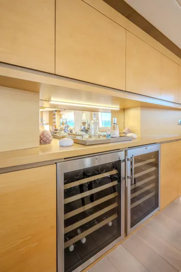  Yacht Photos Pics Modern kitchen area on 2013 Azimut 105 yacht with sleek cabinetry and wine cooler.