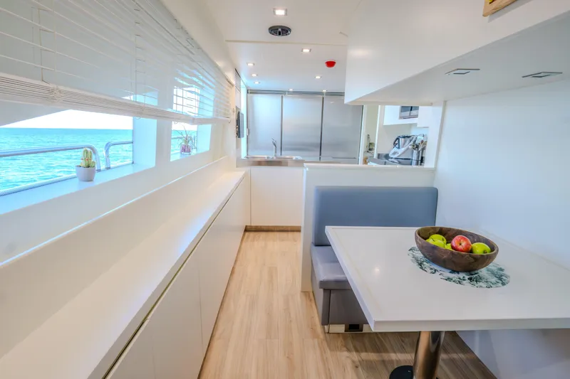  Yacht Photos Pics Luxurious interior of 2013 Azimut 105 yacht with modern dining area and ocean view.