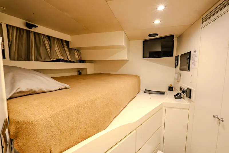  Yacht Photos Pics Luxurious cabin interior of 2013 Azimut 105 yacht with cozy bed and modern amenities.