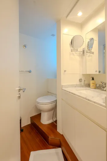  Yacht Photos Pics Luxurious bathroom on 2013 Azimut 105 yacht with modern fixtures and elegant design.