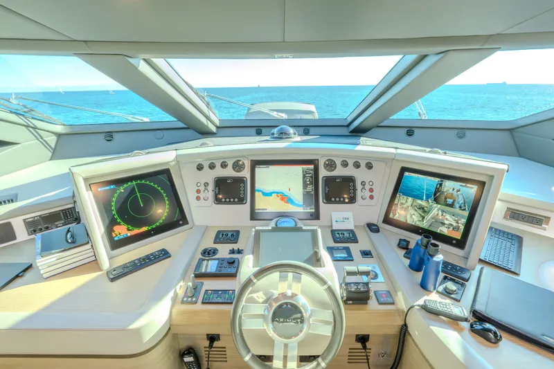  Yacht Photos Pics Cockpit of 2013 Azimut 105 yacht with advanced navigation systems and ocean view.