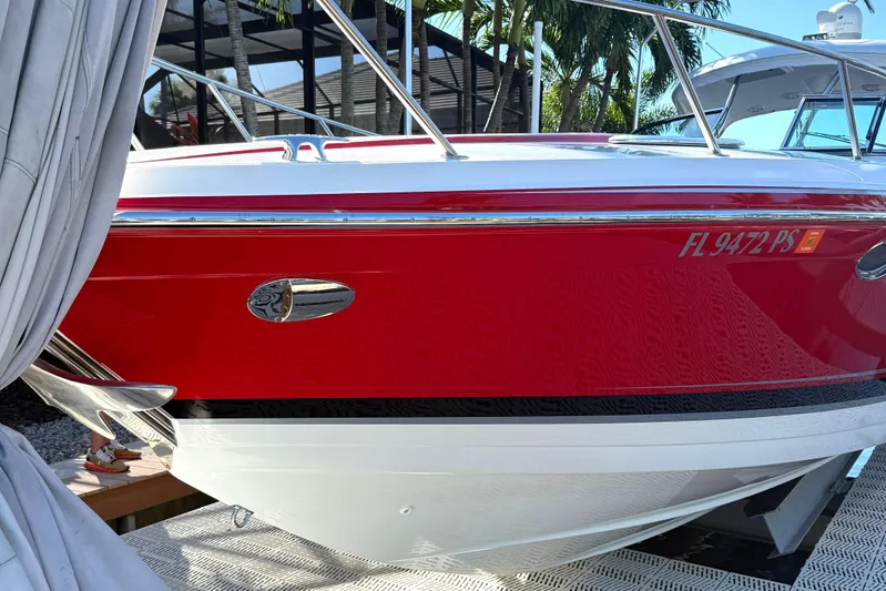  Yacht Photos Pics 2015 Formula 400 Super Sport boat docked, red and white exterior, surrounded by palm trees.