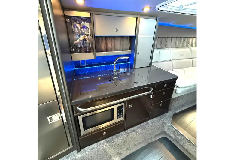  Yacht Photos Pics Luxurious interior of 2015 Formula 400 Super Sport yacht with modern kitchenette and seating area.