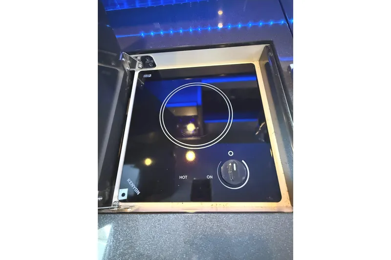  Yacht Photos Pics Built-in Kenyon cooktop on 2015 Formula 400 Super Sport yacht, featuring sleek black design.