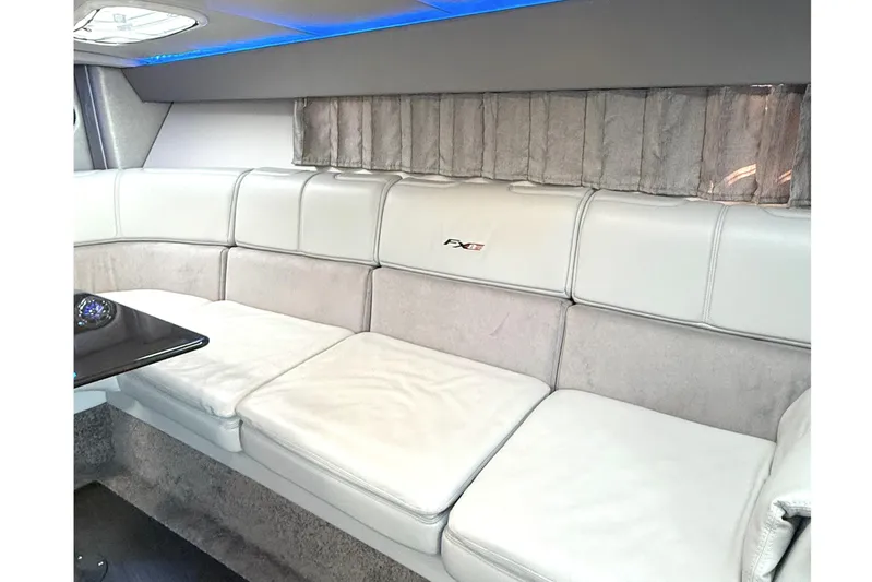  Yacht Photos Pics Luxurious interior of a 2015 Formula 400 Super Sport boat with plush seating and ambient lighting.