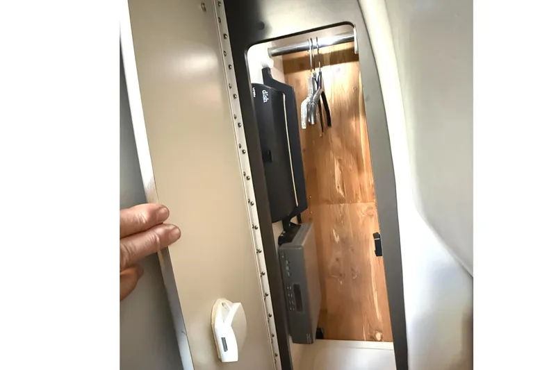  Yacht Photos Pics 2015 Formula 400 Super Sport interior storage compartment with wooden panel and hanging space.