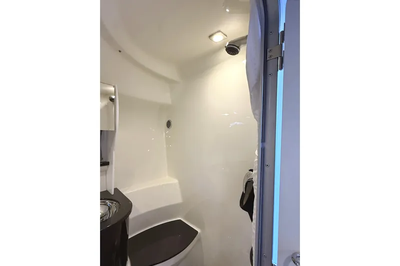  Yacht Photos Pics 2015 Formula 400 Super Sport boat bathroom interior with modern fixtures and lighting.