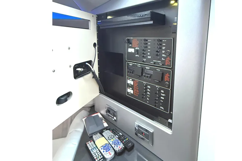  Yacht Photos Pics Control panel and remotes inside 2015 Formula 400 Super Sport boat cabin.