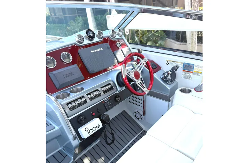  Yacht Photos Pics 2015 Formula 400 Super Sport boat cockpit with red steering wheel and modern controls.