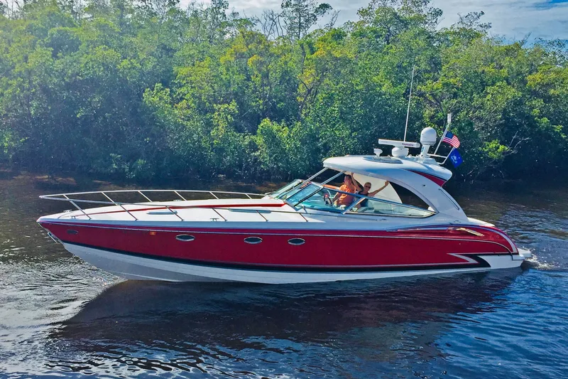  Yacht Photos Pics 2015 Formula 400 Super Sport boat cruising on a scenic waterway.