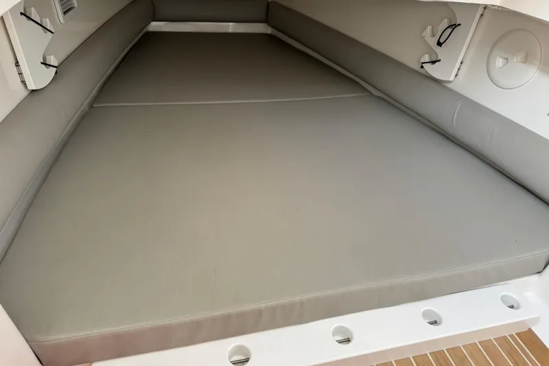  Yacht Photos Pics 2022 Regulator 34 boat interior cabin with cushioned seating area.