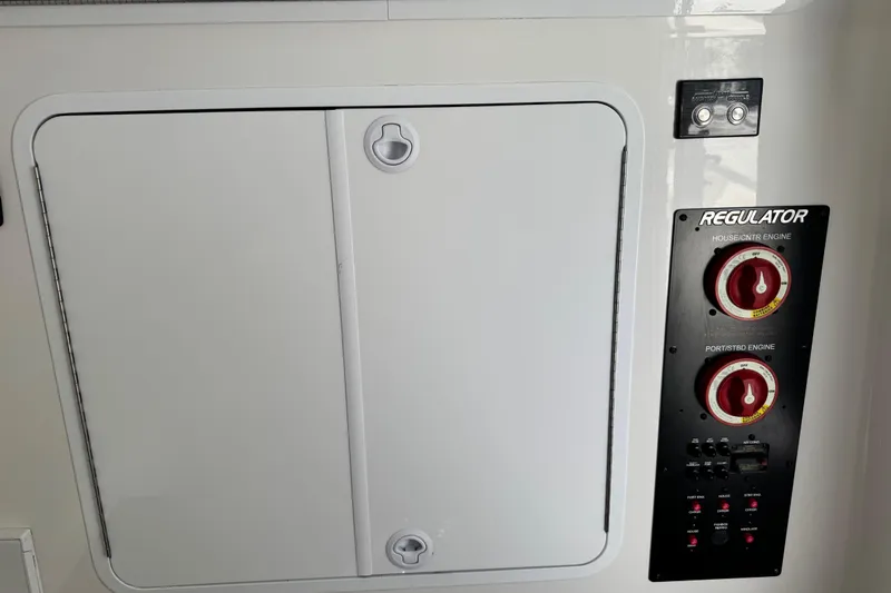  Yacht Photos Pics Control panel of a 2022 Regulator 34 boat with engine switches.