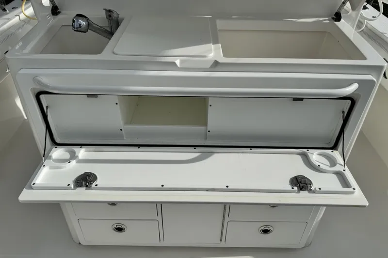  Yacht Photos Pics 2022 Regulator 34 boat interior with open storage compartments and sink.