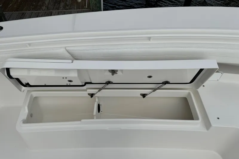  Yacht Photos Pics 2022 Regulator 34 boat storage compartment open, showcasing interior space.