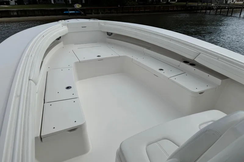  Yacht Photos Pics 2022 Regulator 34 boat interior with spacious seating and storage compartments.