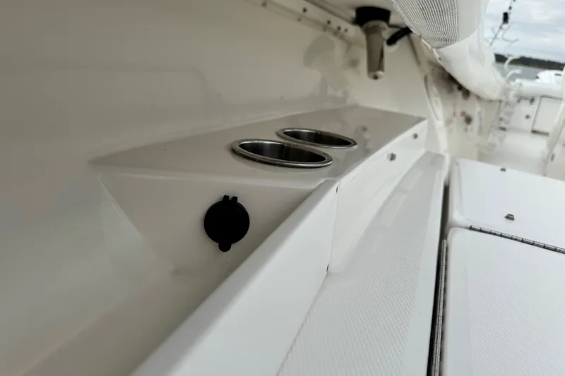  Yacht Photos Pics 2022 Regulator 34 boat interior with cup holders and sleek white design.