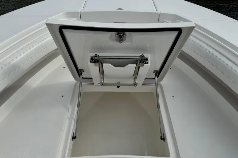  Yacht Photos Pics Open storage compartment on 2022 Regulator 34 boat, showcasing interior space and design.